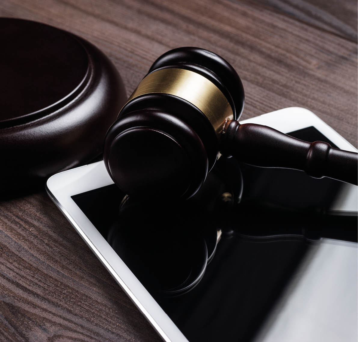 judge gavel and tablet computer on the table