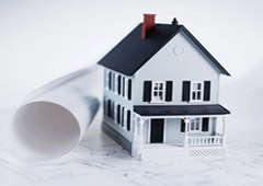 La figura de una casa y debajo unos planos