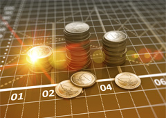 Monedas de euros sobre gráfico