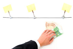 Los créditos refaccionarios y los privilegios de autor Una mano con billetes y unos post-it tendidos